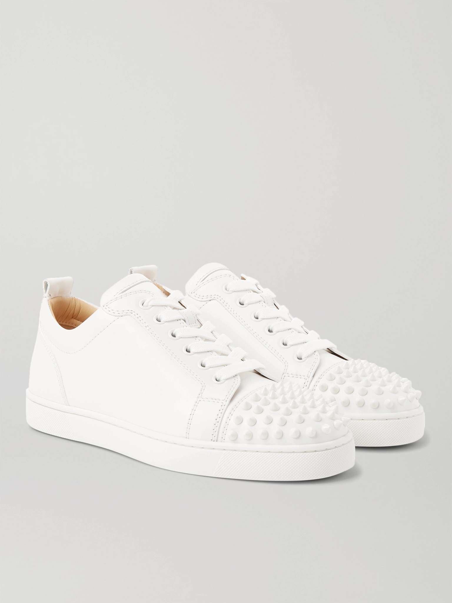 CHRISTIAN LOUBOUTIN
Louis Junior Spikes Cap-Toe Suede Sneakers