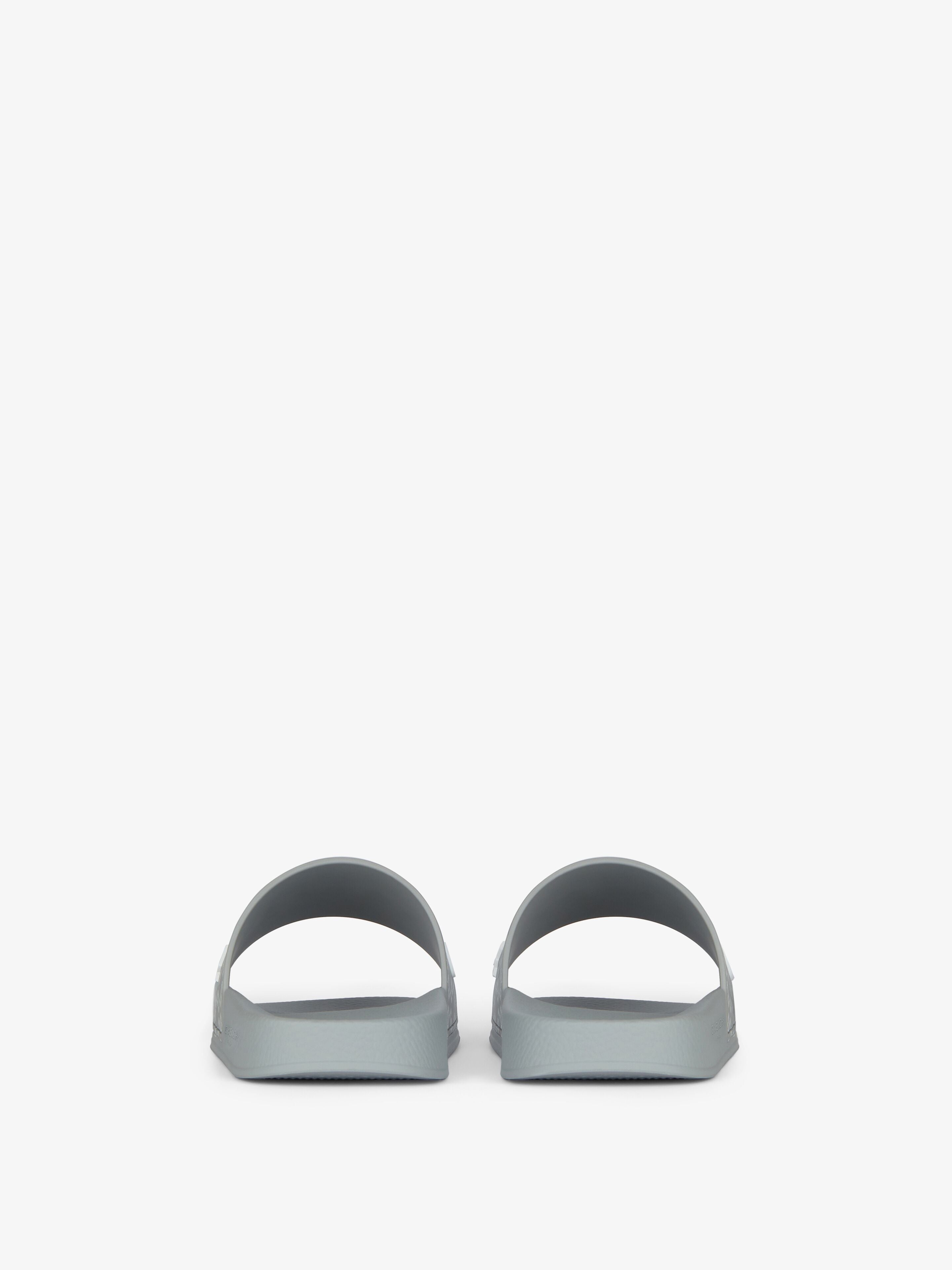 New
Slide flat sandals in monogram 72 rubber
